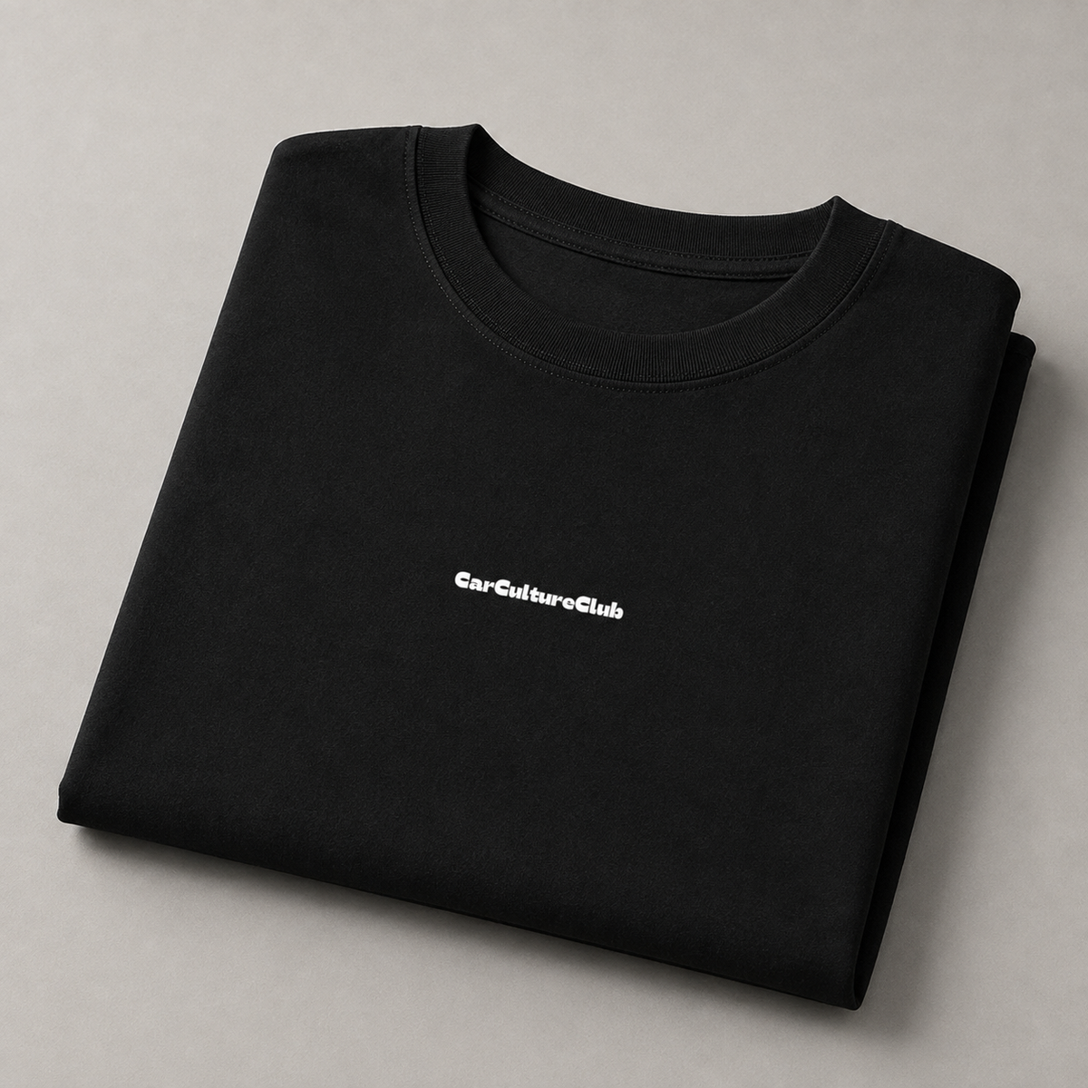 Folded black CarCultureClub T-shirt showing the front chest logo