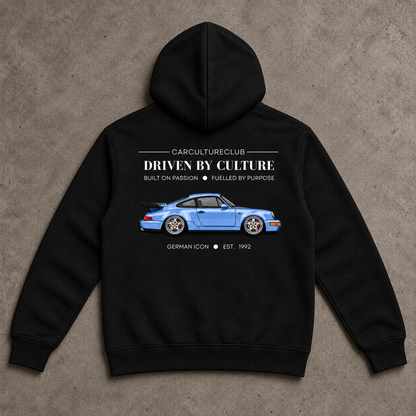 German Icon Hoodie — Black, full back flat lay on stone