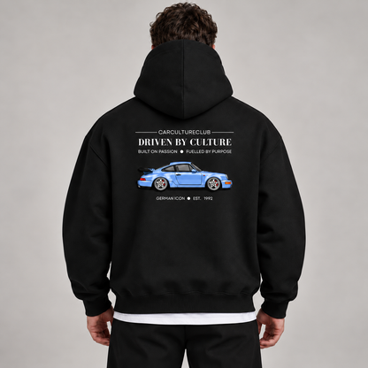 German Icon Hoodie — Black, studio view with white T-shirt layer
