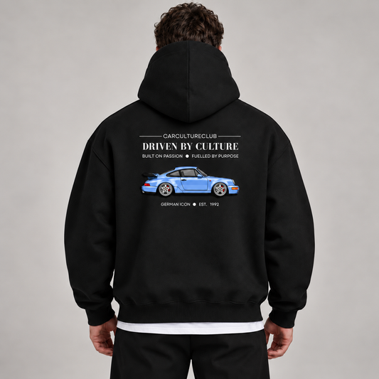 German Icon Hoodie — Black, studio view with white T-shirt layer